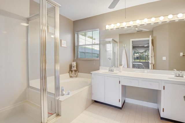 bathroom with tile patterned flooring, vanity, ceiling fan, and shower with separate bathtub