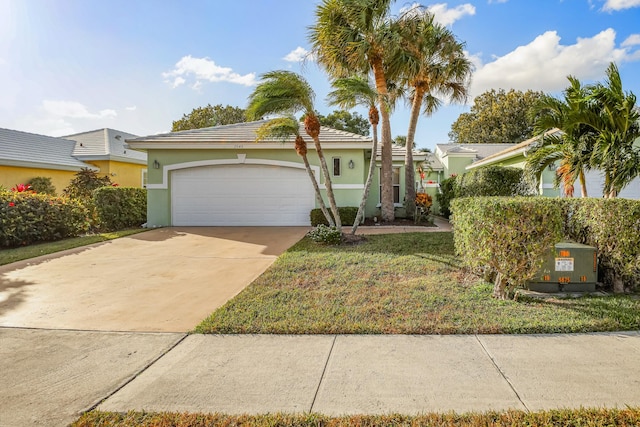 view of front of house with a garage and a front yard