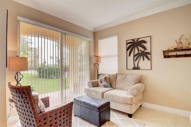 living area with a wealth of natural light, light tile patterned flooring, and ornamental molding