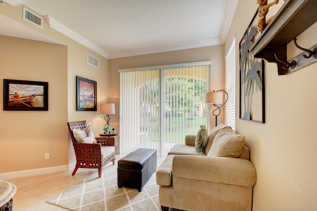 sitting room featuring light tile patterned floors and crown molding