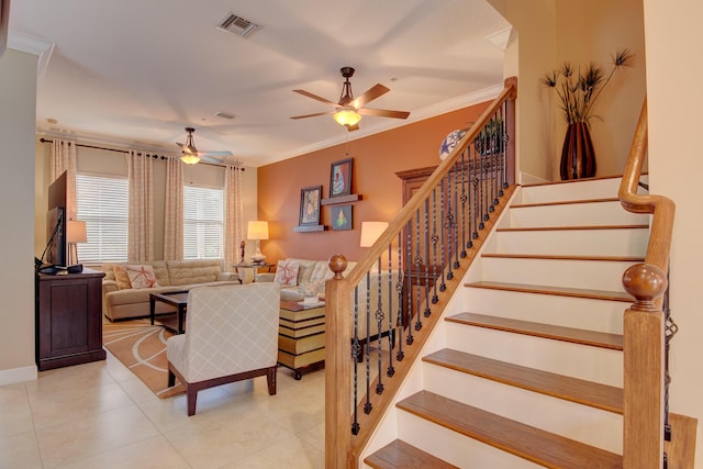 living room featuring ceiling fan, crown molding, and light tile patterned floors