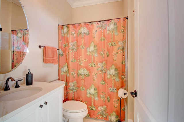 bathroom with vanity, toilet, and ornamental molding