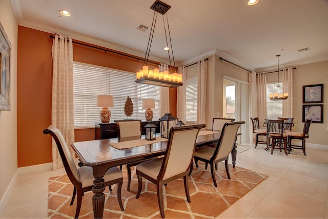 dining area featuring ornamental molding and light tile patterned floors