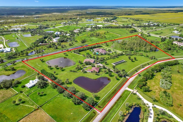 aerial view featuring a rural view and a water view