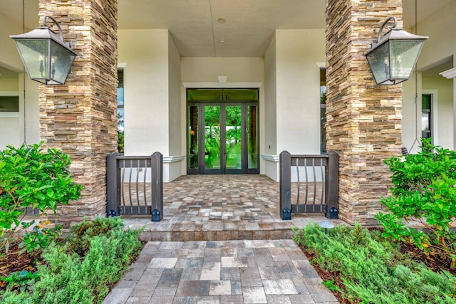 entrance to property featuring french doors