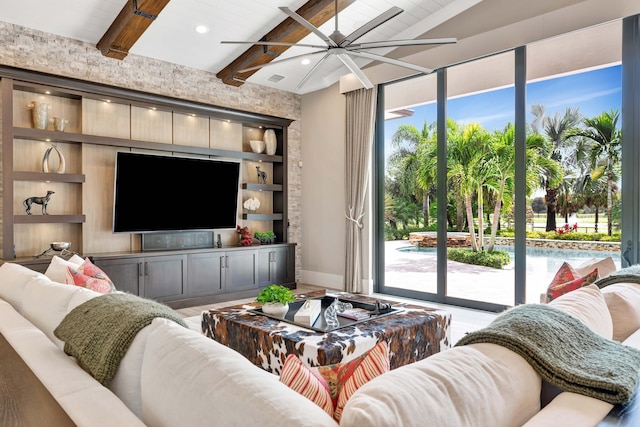 living room featuring built in shelves, ceiling fan, wood-type flooring, and lofted ceiling with beams