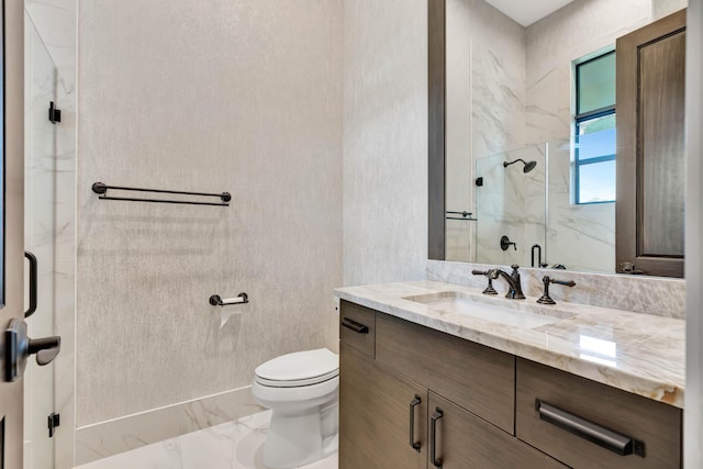 bathroom with vanity, an enclosed shower, and toilet