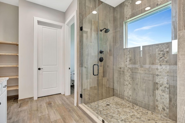 bathroom featuring toilet and walk in shower