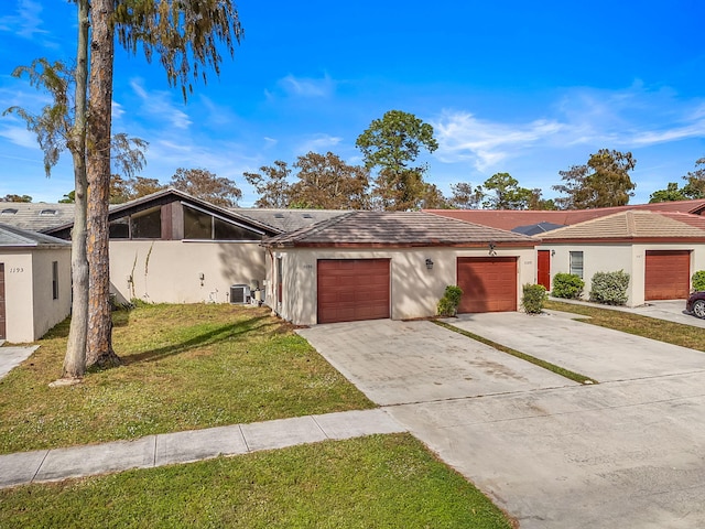 view of front of house featuring a garage and a front yard