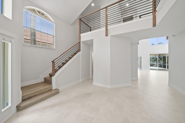 interior space with a wealth of natural light and a high ceiling