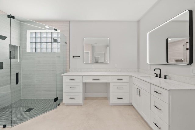 bathroom featuring vanity and an enclosed shower