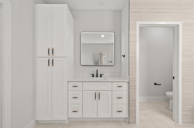 bathroom with vanity and toilet