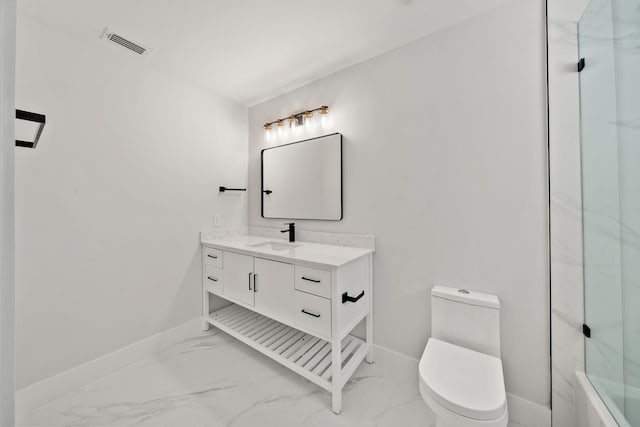 bathroom with vanity, toilet, and a shower