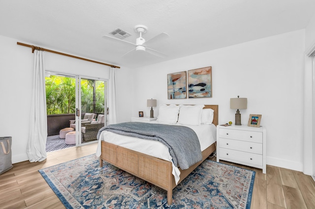 bedroom featuring access to exterior, ceiling fan, and light hardwood / wood-style floors