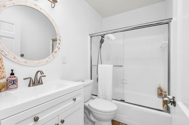 full bathroom featuring vanity, toilet, and enclosed tub / shower combo