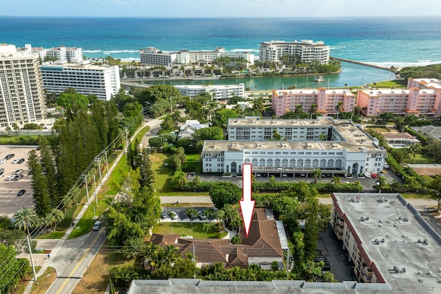 birds eye view of property featuring a water view