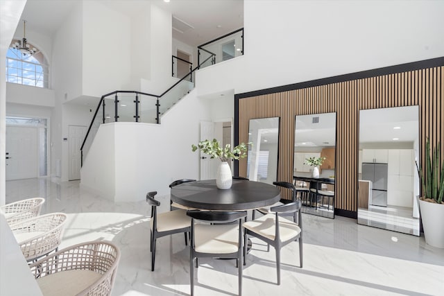 dining room featuring a high ceiling