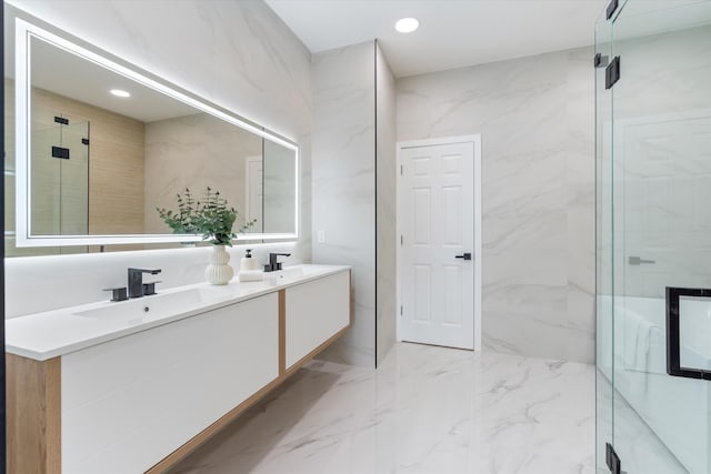 bathroom with vanity and an enclosed shower