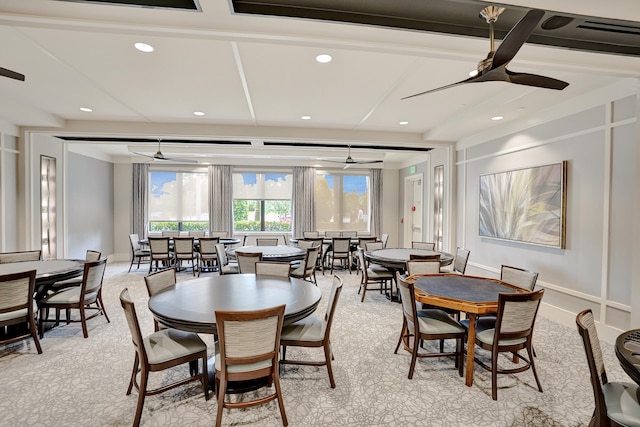 dining space featuring ceiling fan and light carpet