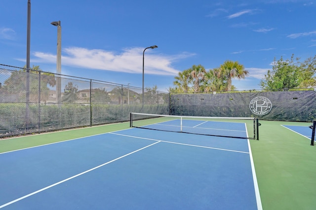 view of sport court with basketball hoop