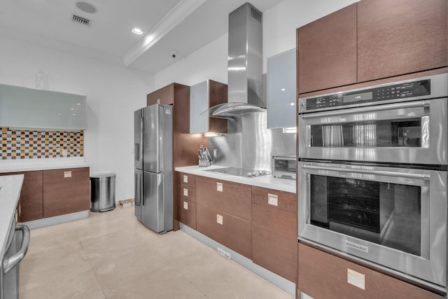 kitchen featuring appliances with stainless steel finishes, backsplash, ornamental molding, wall chimney exhaust hood, and light tile patterned floors