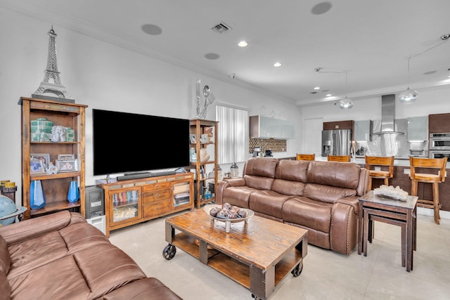 tiled living room featuring crown molding