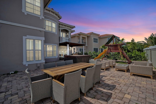 patio terrace at dusk with a playground