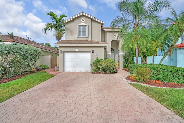 mediterranean / spanish house featuring a garage