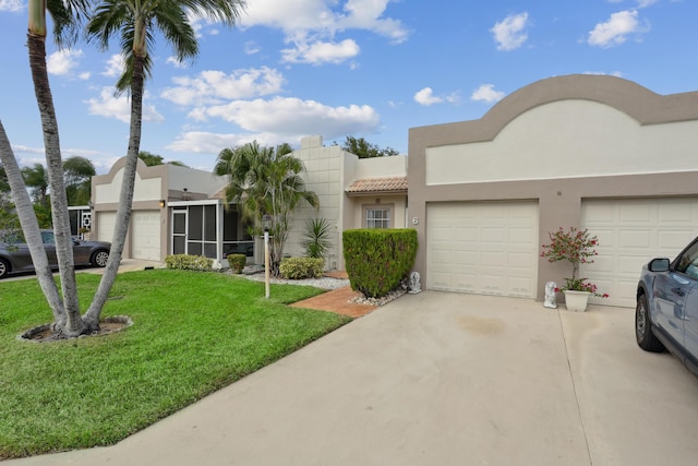 view of front facade featuring a front lawn and a garage