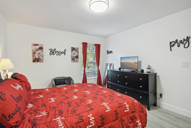 bedroom with hardwood / wood-style floors