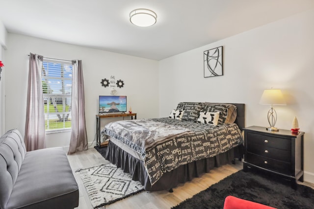 bedroom with light hardwood / wood-style floors