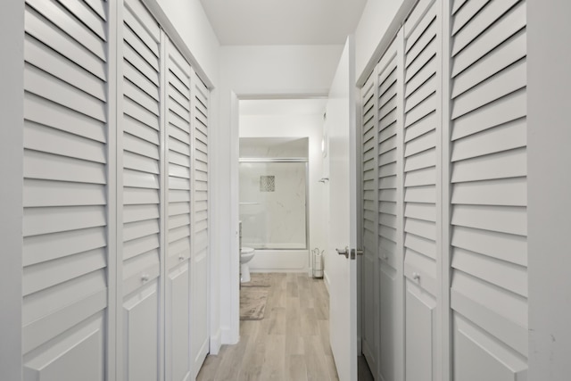 hall with light hardwood / wood-style flooring