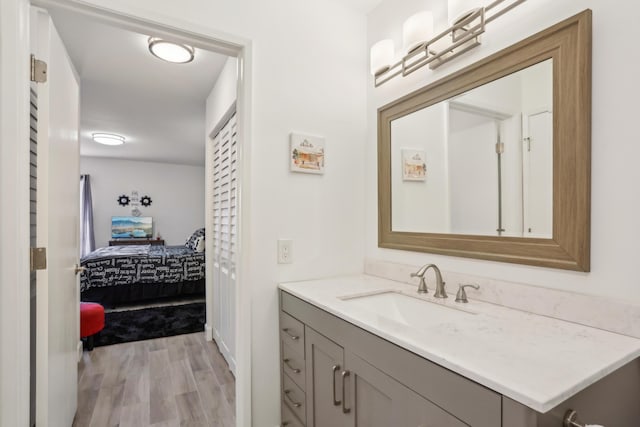 bathroom featuring hardwood / wood-style flooring and vanity