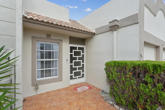 doorway to property featuring a garage