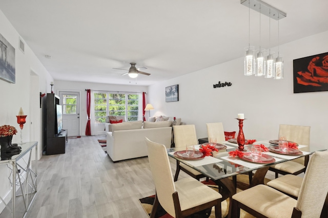 dining area featuring ceiling fan and light hardwood / wood-style flooring