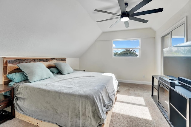 carpeted bedroom featuring vaulted ceiling and ceiling fan