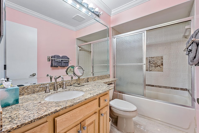 full bathroom featuring tile patterned floors, ornamental molding, vanity, enclosed tub / shower combo, and toilet