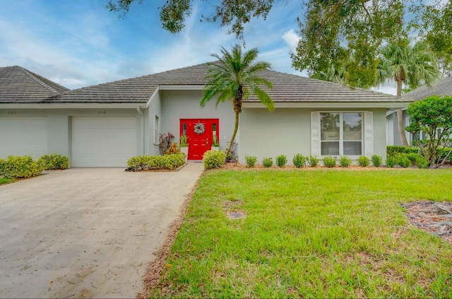 ranch-style house with a front lawn and a garage