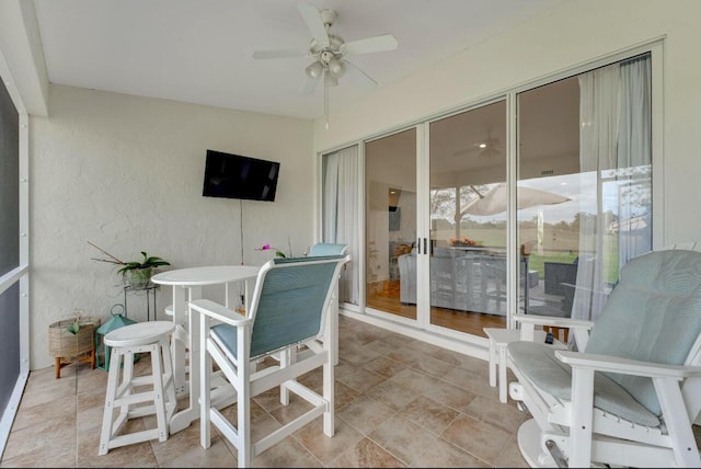 sunroom / solarium with ceiling fan