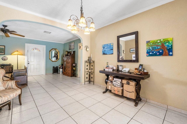 interior space with light tile patterned floors, a chandelier, crown molding, and a textured ceiling