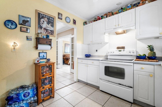 kitchen with white cabinetry, light tile patterned floors, and white range with electric cooktop