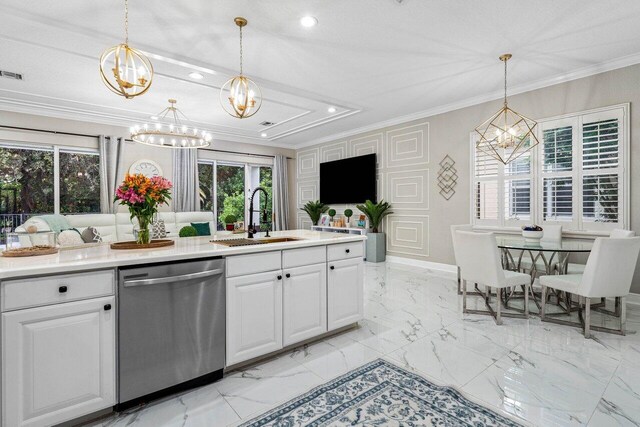 kitchen featuring decorative backsplash, appliances with stainless steel finishes, white cabinetry, hanging light fixtures, and a breakfast bar area