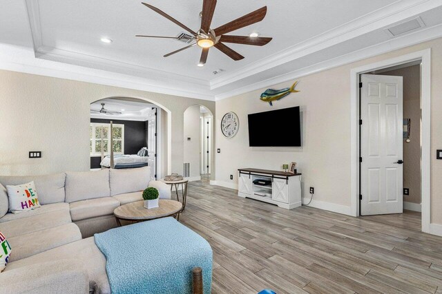 bedroom with ceiling fan, ornamental molding, and hardwood / wood-style flooring