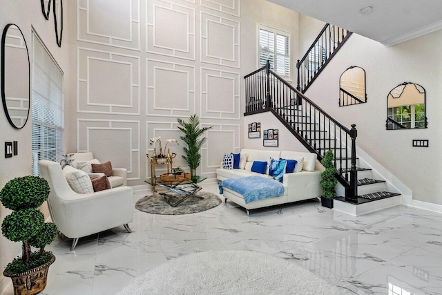 living area with stairs, baseboards, and marble finish floor