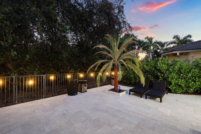 view of patio terrace at dusk