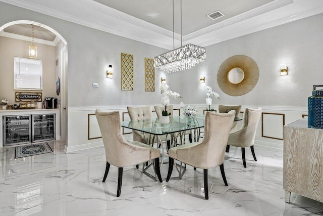 dining space featuring wine cooler and crown molding