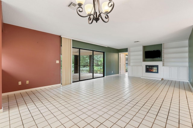 unfurnished living room with light tile patterned floors, built in features, and an inviting chandelier