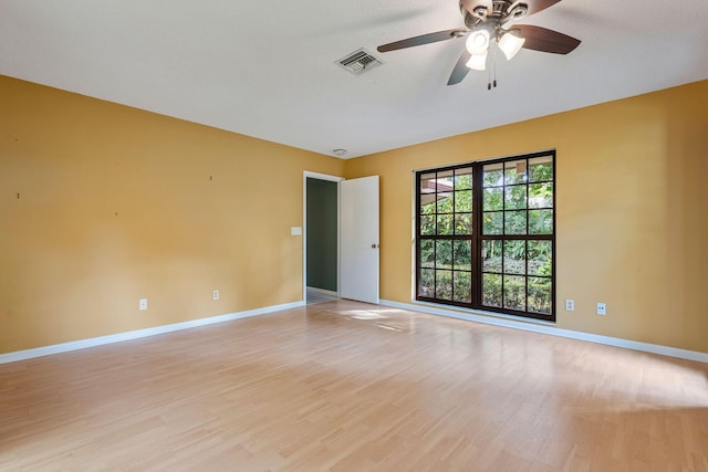 unfurnished room with ceiling fan and light hardwood / wood-style floors