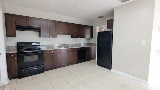 kitchen with light tile patterned floors, sink, dark brown cabinetry, and black appliances