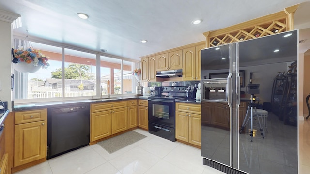 kitchen featuring decorative backsplash, sink, light tile patterned flooring, and black appliances